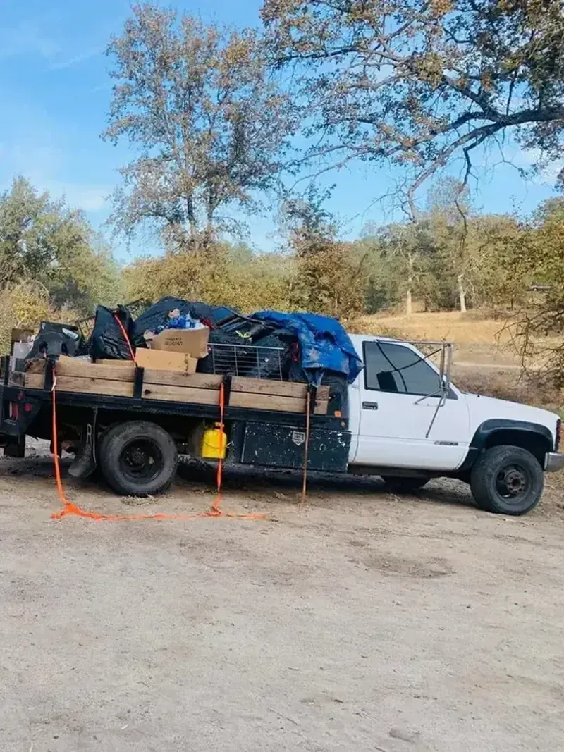 Two trucks loaded to the top with a full property cleanout